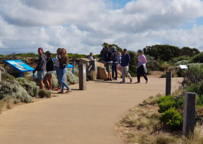 people on the board walk at the Apostles
